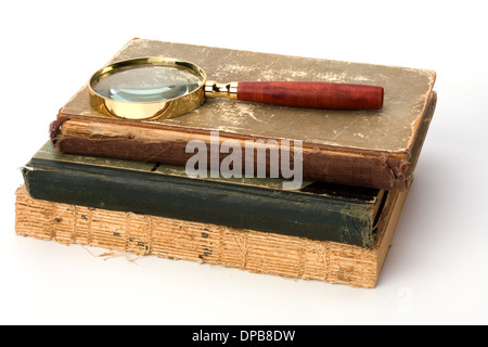 tattered book stack over white background Stock Photo