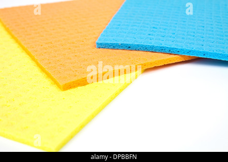 Kitchen towels porous absorbent material in yellow, orange and blue Stock Photo