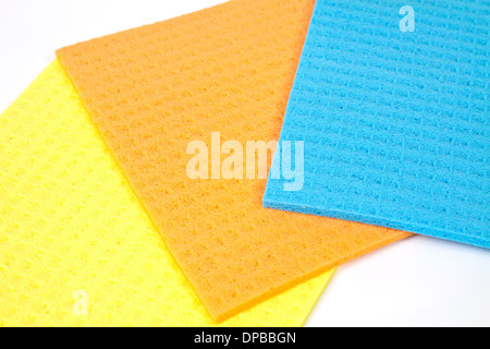 Kitchen towels porous absorbent material in yellow, orange and blue Stock Photo