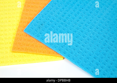 Kitchen towels porous absorbent material in yellow, orange and blue Stock Photo