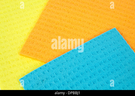 Kitchen towels porous absorbent material in yellow, orange and blue Stock Photo