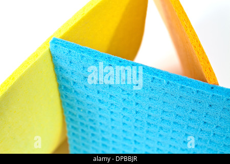 Kitchen towels porous absorbent material in yellow, orange and blue Stock Photo