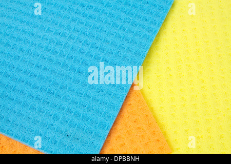 Kitchen towels porous absorbent material in yellow, orange and blue Stock Photo