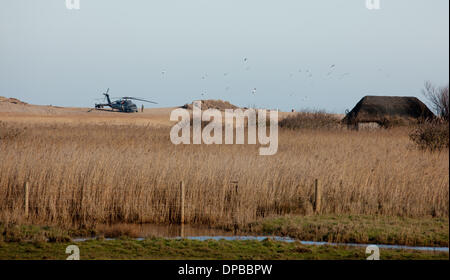 Cley, Norfolk, UK. 11th January 2014. USAF HH-60G Pave Hawk helicopter at  site on the North Norfolk coast at Cley where another crashed leaving four US airmen dead Credit:  Tim James/The Gray Gallery/Alamy Live News Stock Photo