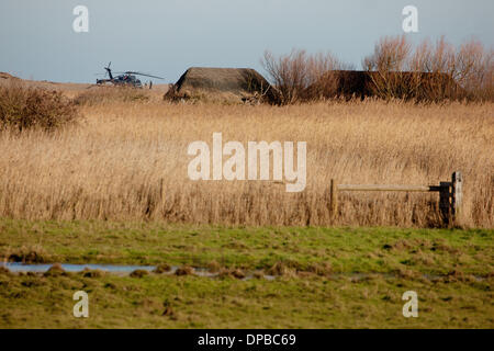 Cley, Norfolk, UK. 11th January 2014. USAF HH-60G Pave Hawk helicopter at  site on the North Norfolk coast at Cley where another crashed leaving four US airmen dead Credit:  Tim James/The Gray Gallery/Alamy Live News Stock Photo