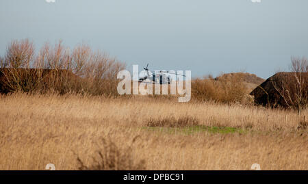 Cley, Norfolk, UK. 11th January 2014. USAF HH-60G Pave Hawk helicopter at  site on the North Norfolk coast at Cley where another crashed leaving four US airmen dead Credit:  Tim James/The Gray Gallery/Alamy Live News Stock Photo