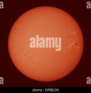 London, UK. 11th January 2014. Giant sunspot AR1944 is gradually approaching the edge of the solar disk, seen in this Hydrogen alpha filtered telescope image. One of the largest sunspots to be seen in a decade, it erupted with a powerful flare on January 7th while Earth facing. The resulting Coronal Mass Ejection (CME) produced aurora observations on Earth on the 10th January. Credit:  Malcolm Park editorial/Alamy Live News Stock Photo