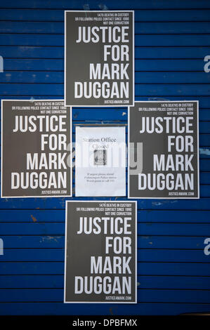 Tottenham Police Station, London, UK. 11th January, 2014. A crowd in excess of a thousand gathered to pay their respects to the death of Mark Duggan outside Tottenham police station, north London. Earlier this week a jury returned a verdict of 8 to 2 that Duggan was lawfully killed by police. Credit:  Lee Thomas/Alamy Live News Stock Photo