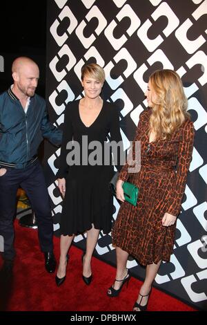 Los Angeles, California, USA. 10th January 2014. US-actor Ben Foster (L-R), US-actress Robin Wright and Dylan Penn attend Diane Von Furstenberg's Journey of A Dress Exhibition Opening Celebration at May Company Building at LACMA West in Los Angeles, USA, on 10 January 2014. Photo: Hubert Boesl/dpa -NO WIRE SERVICE-/Alamy Live News Stock Photo