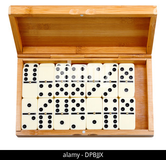 set of dominoes in bamboo box isolated on white background Stock Photo
