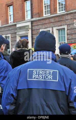 Tottenham High Road, London, UK. 11th January 2014. A 'Street Pastor' at Tottenham Police Station at the vigil for Mark Duggan. Credit:  Matthew Chattle/Alamy Live News Stock Photo