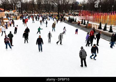 people skating rink on ice covered paths in Gorky Central Park on winter weekends Stock Photo