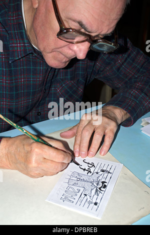The old cartoonist drawing Stock Photo