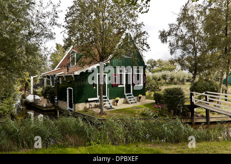 Traditionally gabled house, made of wood and painted green at  Zaanse Schans, Zaandijk, North Holland, The Netherlands. Stock Photo