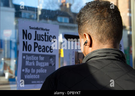 Tottenham London UK. 11th January 2014. Family and relatives of Mark Duggan were joined by hundreds of supporters outside Tottenham police station to fight for justice after an inquest  verdict found Mark Duggan was lawfully killed by police when he was shot in August 2011 Stock Photo