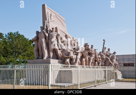 Stone revolutionary monument in front of Mausoleum of Mao Zedong at Tiananmen Square in Beijing, China Stock Photo