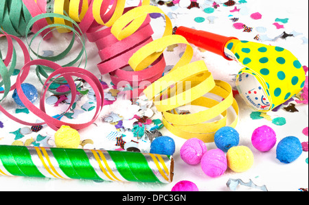 Colorful decoration with garlands, streamer, and confetti. Festive accessory background. Stock Photo