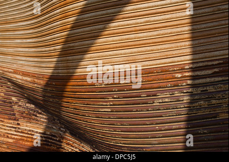 Warped burned rusted warehouse shutter doors Stock Photo