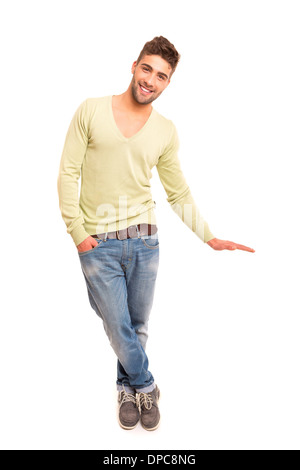 Studio shot of a young handsome man presenting your product Stock Photo