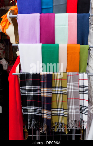 Various colors of wool scarves on display at clothing store - USA Stock Photo