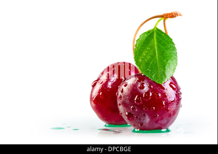 water drops on ripe cherries and leaf Stock Photo