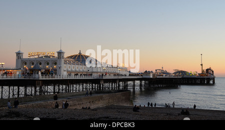 Sunset sea ocean blue orange tobacco ripples calm dusk dawn sunrise Brighton Palace Pier Stock Photo