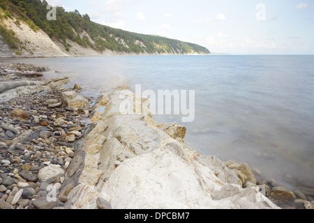 Rocky Black sea coastline. Long exposure shot. Stock Photo