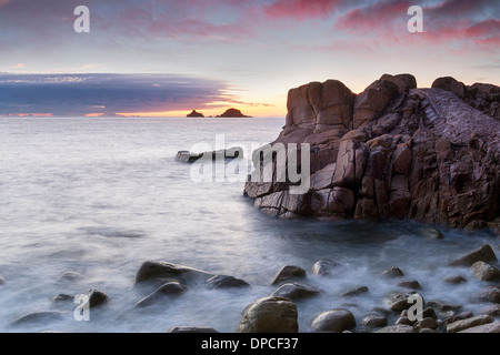 Sunset at Porth Nanven Cove near Lands End in Cornwall Stock Photo