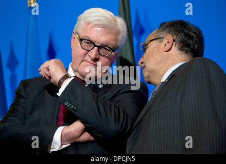 Paris, France. 12th Jan, 2014. German Foreign Minister Frank-Walter Steinmeier (L) speaks with Egyptian Foreign Minister Nabil Fahmy during the ministerial meeting of the core group of the 'Friends of the Syrian people' in Paris, France, 12 January 2014. Steinmeier visits Paris in order to take part in meetings on Syria, before flying to Israel for diplomatic talks and to attend the funeral ceremony for late former Israeli prime minister Ariel Sharon, who died on 11 January. Photo: DANIEL NAUPOLD/dpa/Alamy Live News Stock Photo