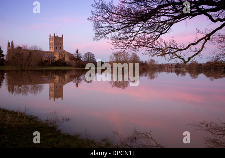 Tewkesbury Abbey, during winter flooding, at sunset Stock Photo