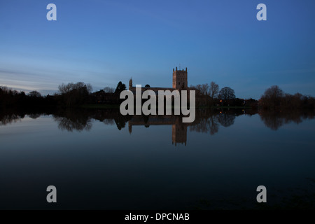 Tewkesbury Abbey, during winter flooding, at sunset Stock Photo