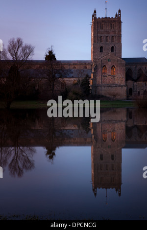 Tewkesbury Abbey, during winter flooding, at sunset Stock Photo