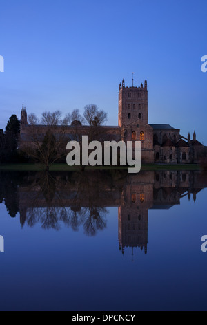 Tewkesbury Abbey, during winter flooding, at sunset Stock Photo