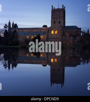 Tewkesbury Abbey, during winter flooding, at sunset Stock Photo