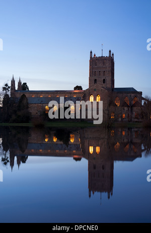 Tewkesbury Abbey, during winter flooding, at sunset Stock Photo