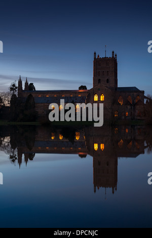 Tewkesbury Abbey, during winter flooding, as night falls Stock Photo