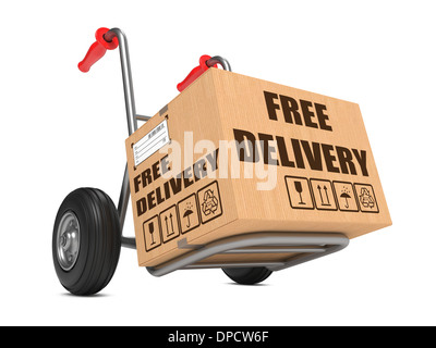 Cardboard Box with Free Delivery Slogan on Hand Truck White Background. Stock Photo