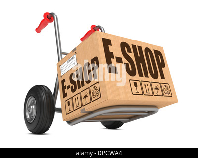 Cardboard Box with E-Shop Slogan on Hand Truck White Background. Stock Photo