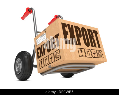 Cardboard Box with Export Slogan on Hand Truck White Background. Stock Photo