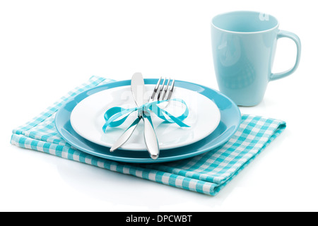 Fork with knife, blank plates, empty cup and napkin. Isolated on white background Stock Photo