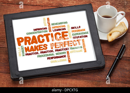 practice makes perfect - related word cloud on a digital tablet with a cup of coffee Stock Photo