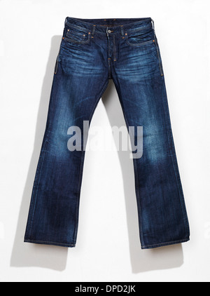 Mens blue jeans, denim pants with a shadow isolated on white wall background Stock Photo