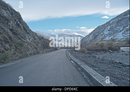 China's Tibet highway snow under the car background Stock Photo