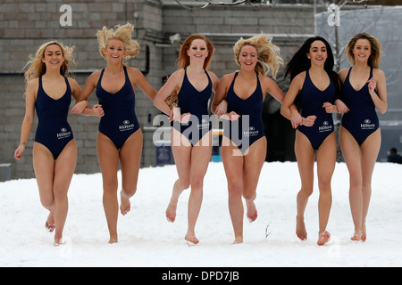 Models in swimsuits poss for photographers during a photocall for Hilton hotels in front of Tower Bridge Stock Photo