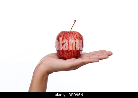 Hand holding red apple against white background Stock Photo