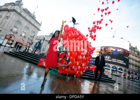 British-American singer Sinitta poses with red balloons for a photograph during a Love London Day Valentine's Day Stock Photo