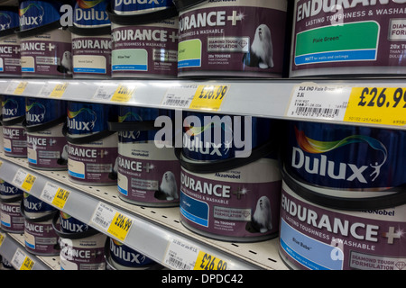 Dulux paint tins displayed on shelf at Homebase DIY store, UK Stock Photo