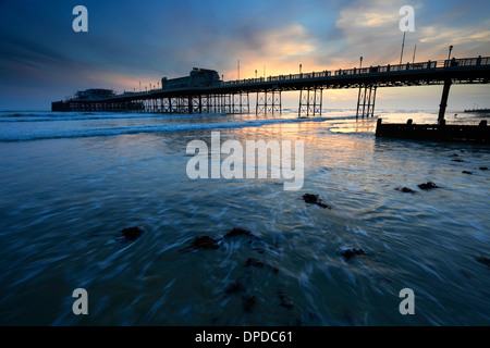 Sunset over the Victorian Pier, Worthing town, West Sussex County, England, UK Stock Photo