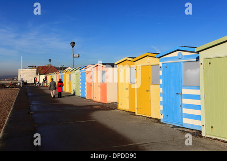 Colourful wooden Beach huts on the promenade, Seaford town, East Sussex, England, UK Stock Photo