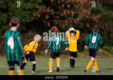 Hartley Wintney Falcons junior football team (yellow) play Curley Park Rangers in a youth football match in Hampshire 14-12-13 Stock Photo